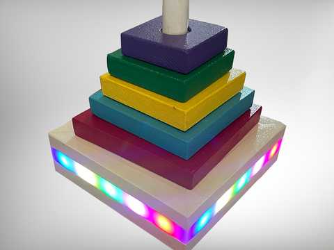 Five toy blocks on base with lights
