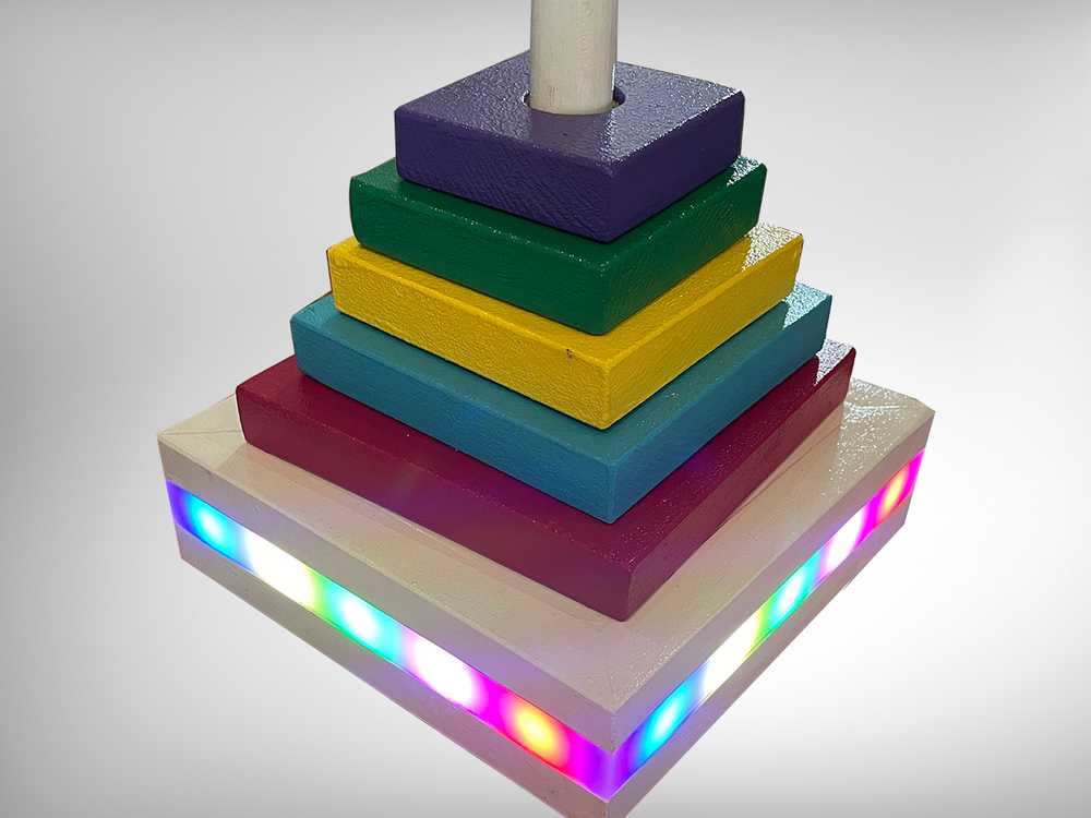 Five toy blocks on base with lights